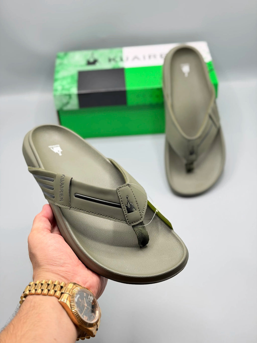 Kuairen Olive Green Premium Flip Flops – hand held view
