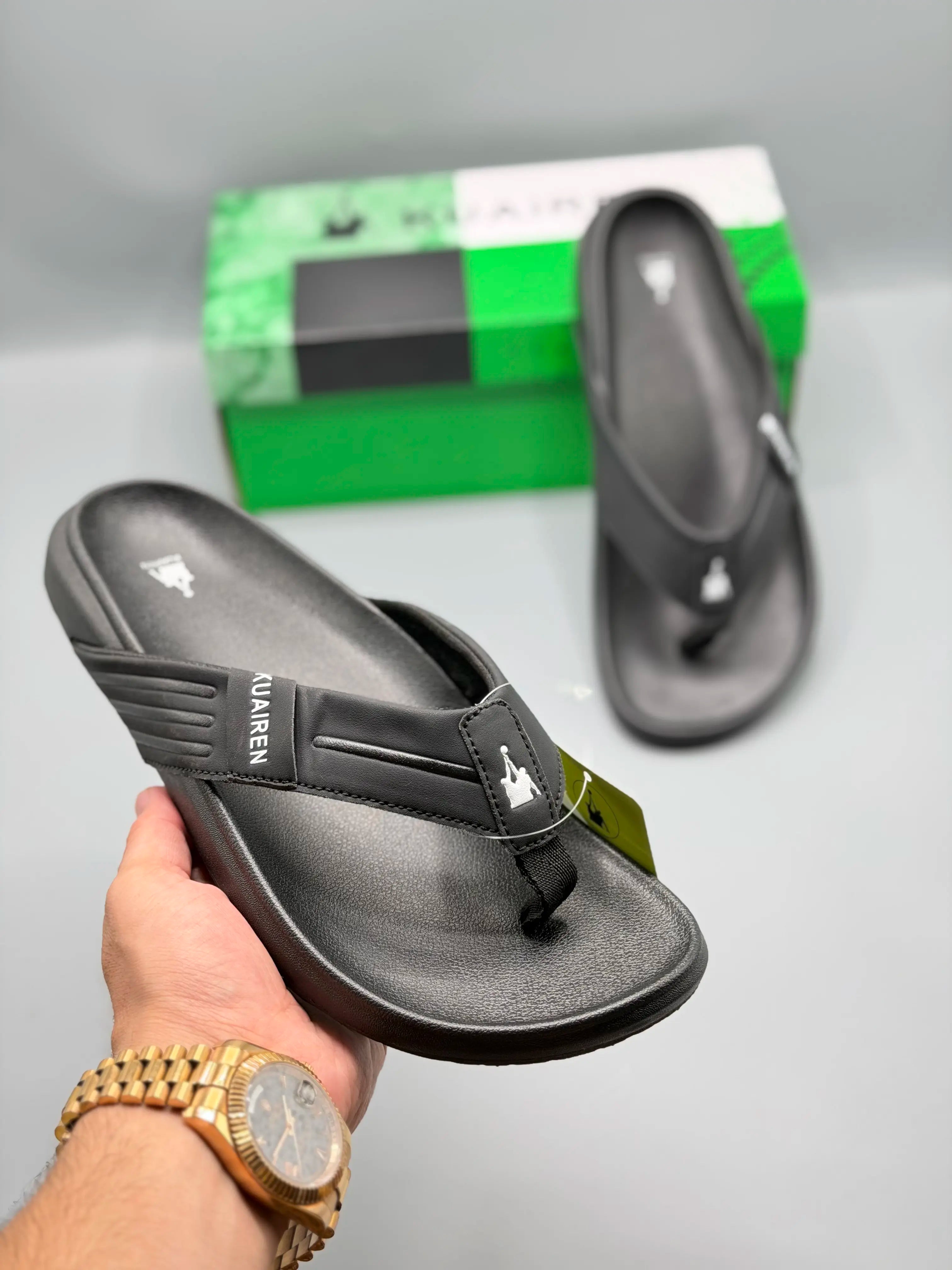 Kuairen Black Premium Flip Flops – hand held view