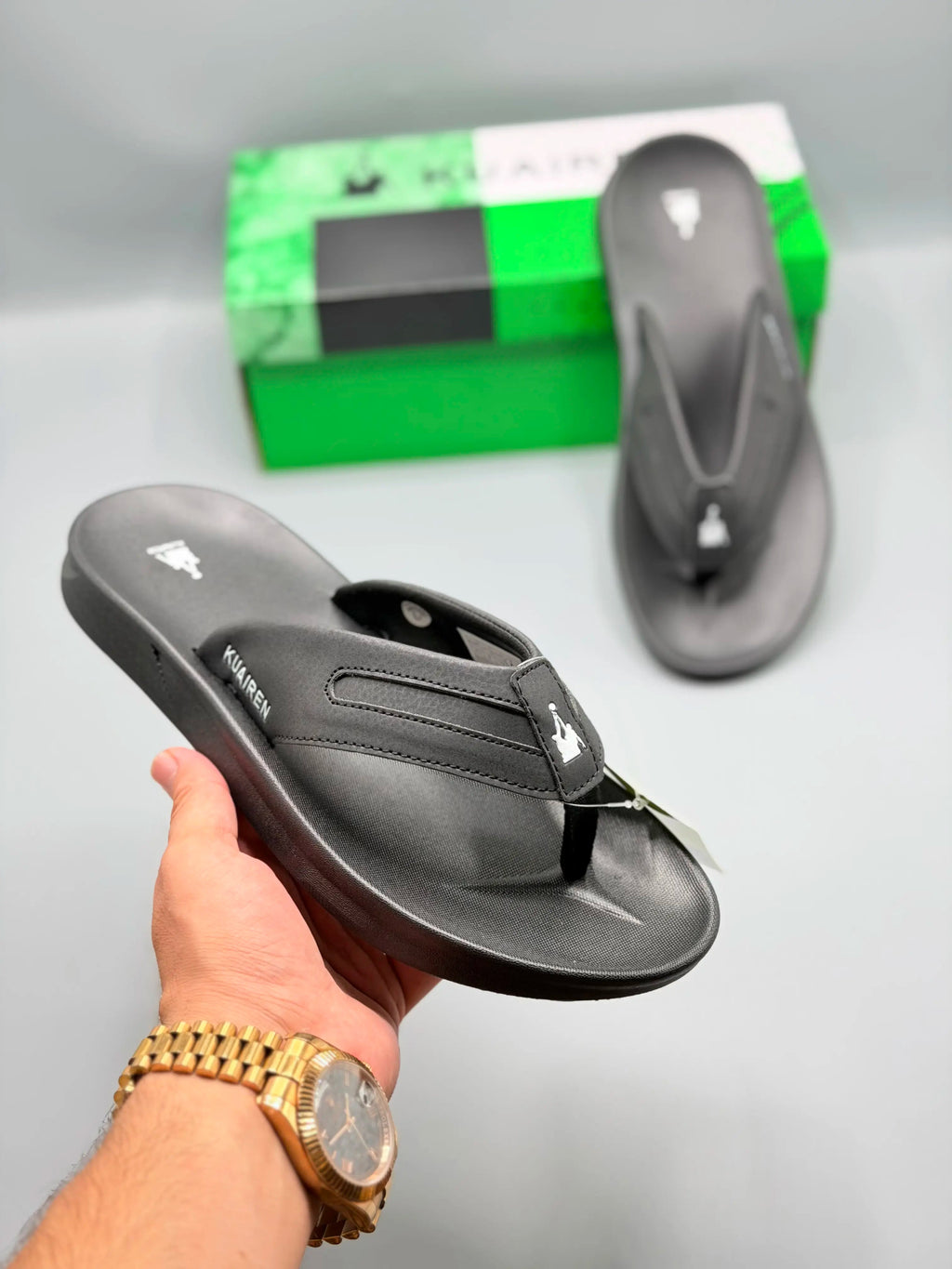 Kuairen Graphite Black Sport Flip Flops – hand held view