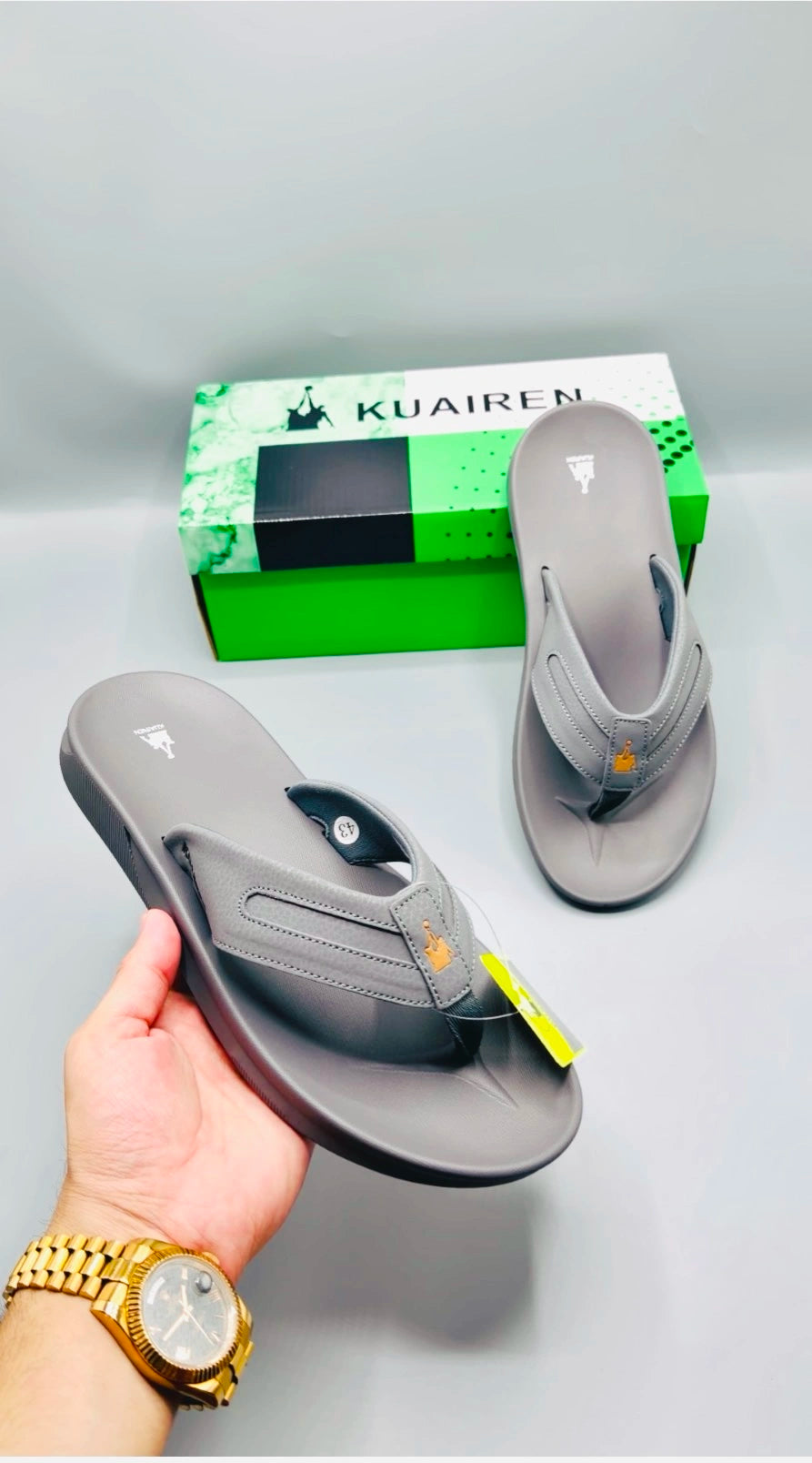 Kuairen Grey Gold Sport Flip Flops – hand held view